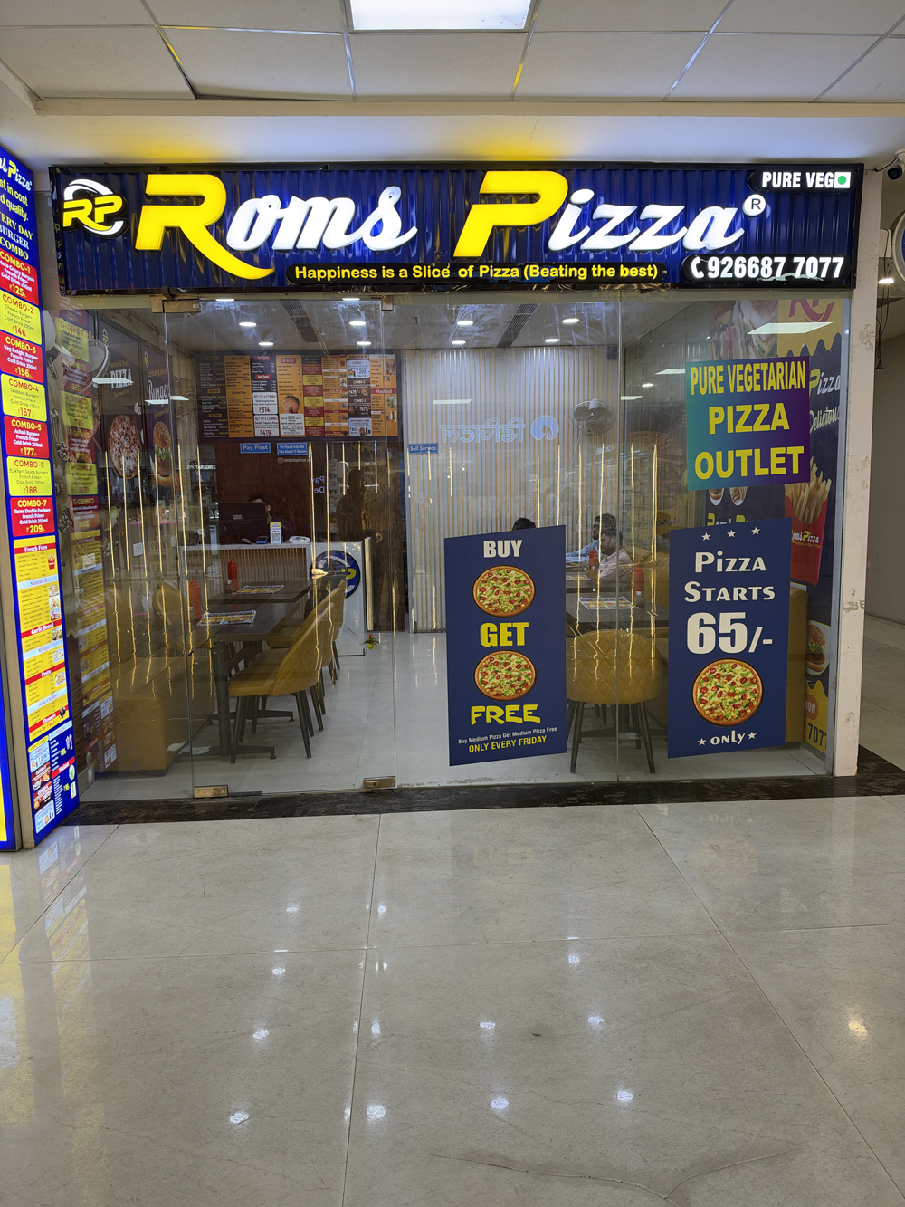 Freshly prepared pizza at Roms Pizza